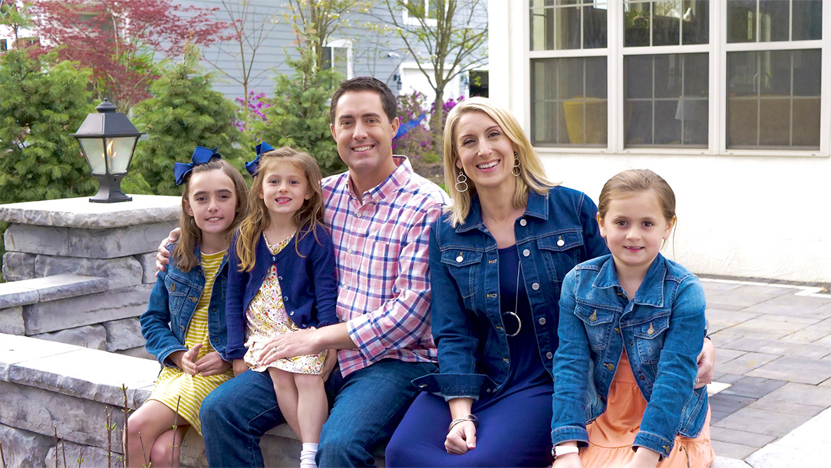 Frank LaRose and his wife and three daughters sitting outside