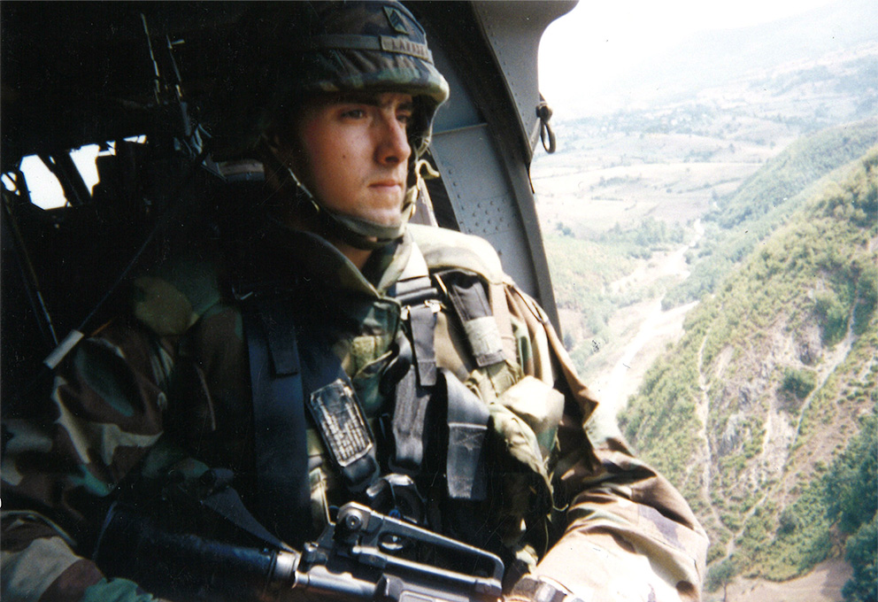 Frank LaRose in a helicopter in full Army uniform