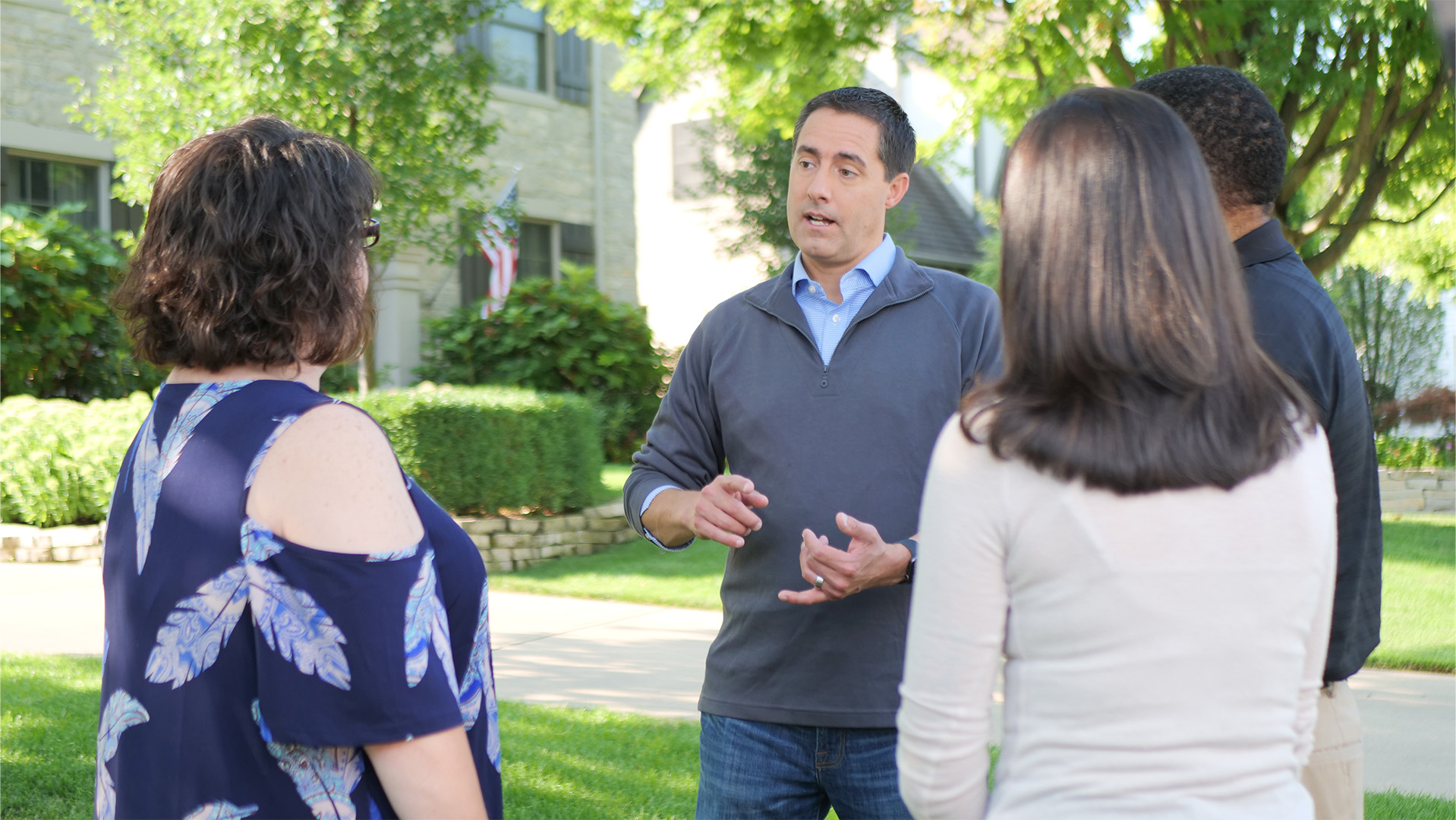 Frank LaRose standing outside and talking with a group of voters
